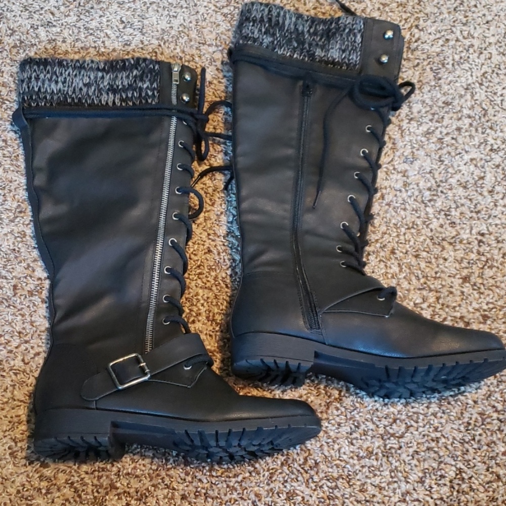 Knee high combat boots.